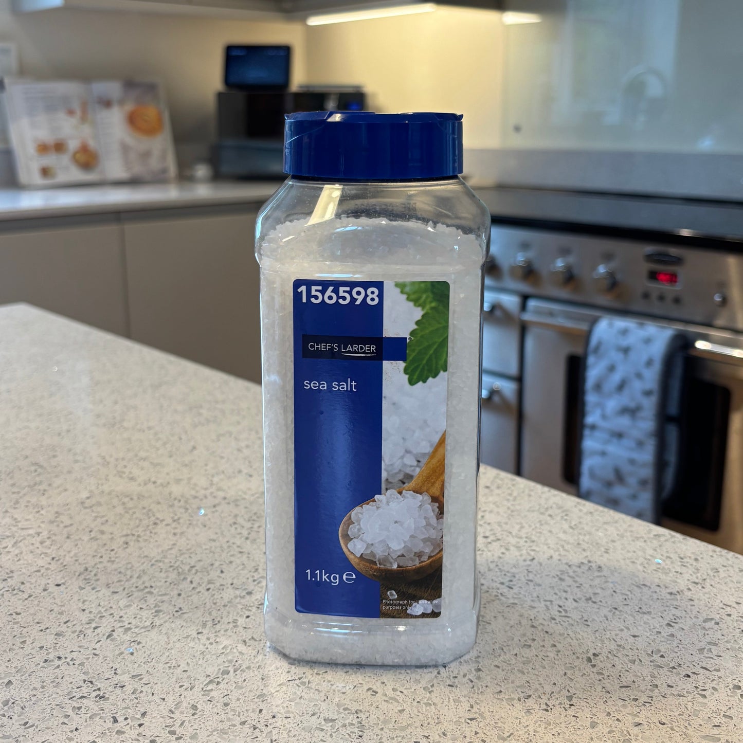 Bottle of Chef's larder Sea salt with blue cap on a kitchen counter