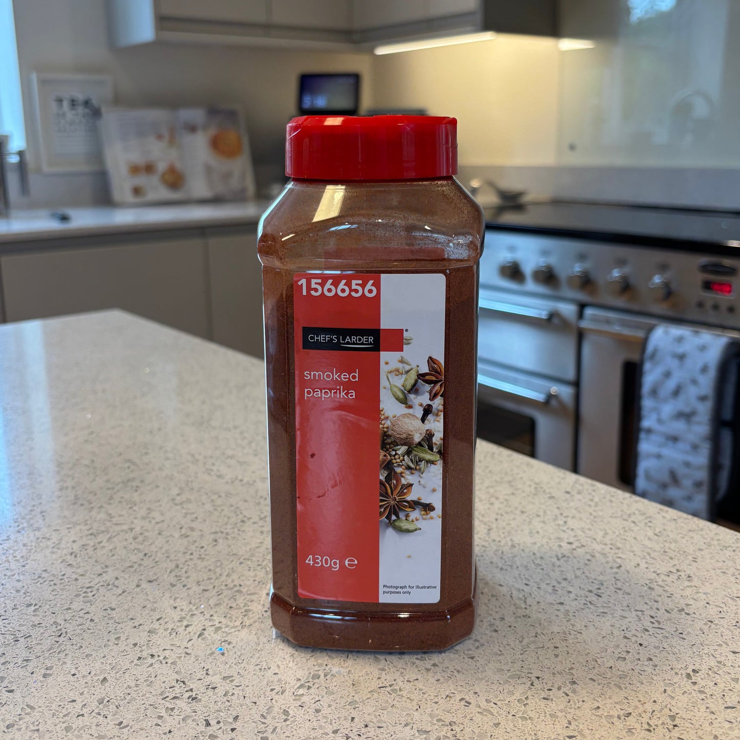 Bottle of smoked paprika on a kitchen counter