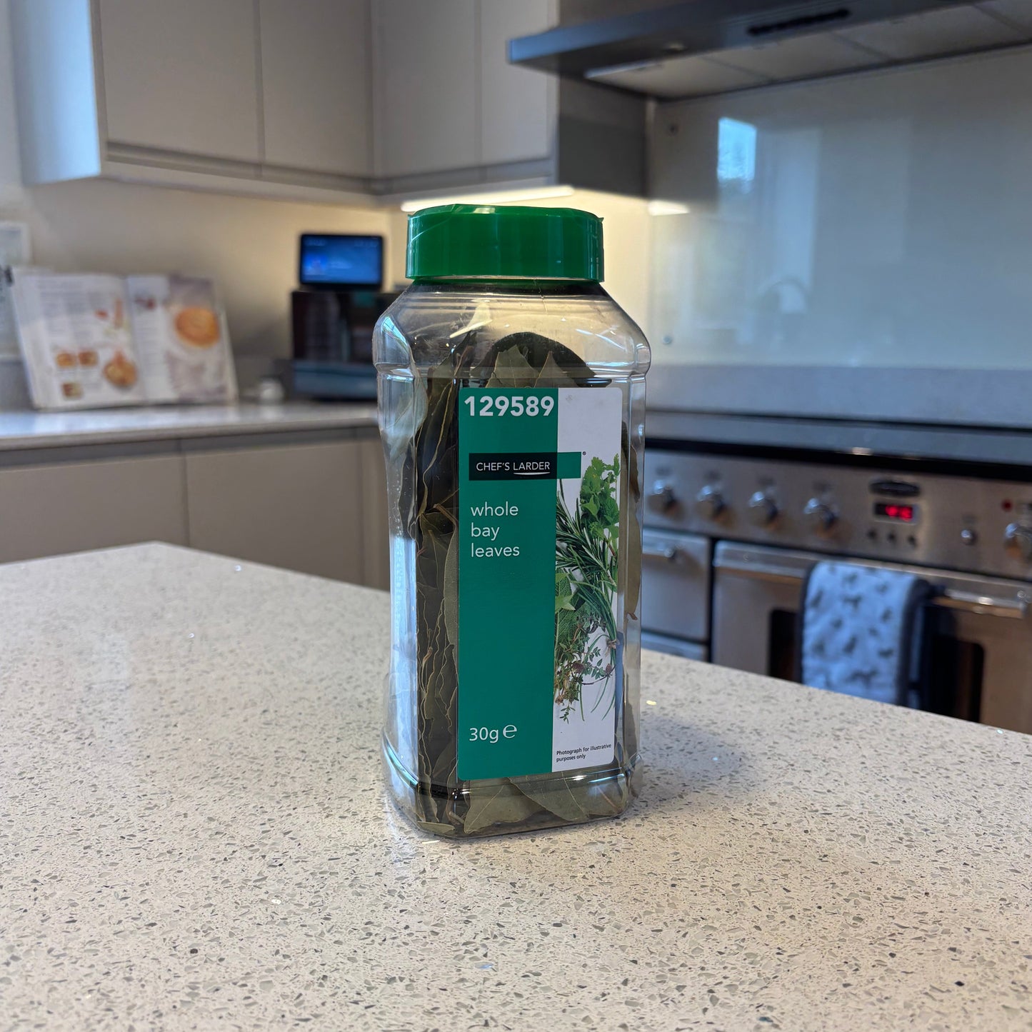 Clear bottle with green label on a kitchen counter