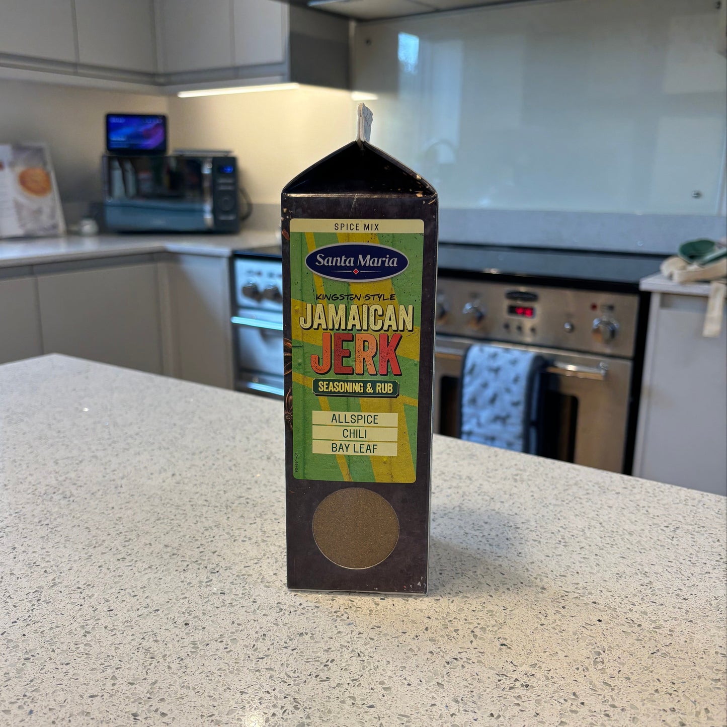 Jamaican jerk seasoning bottle on a kitchen counter