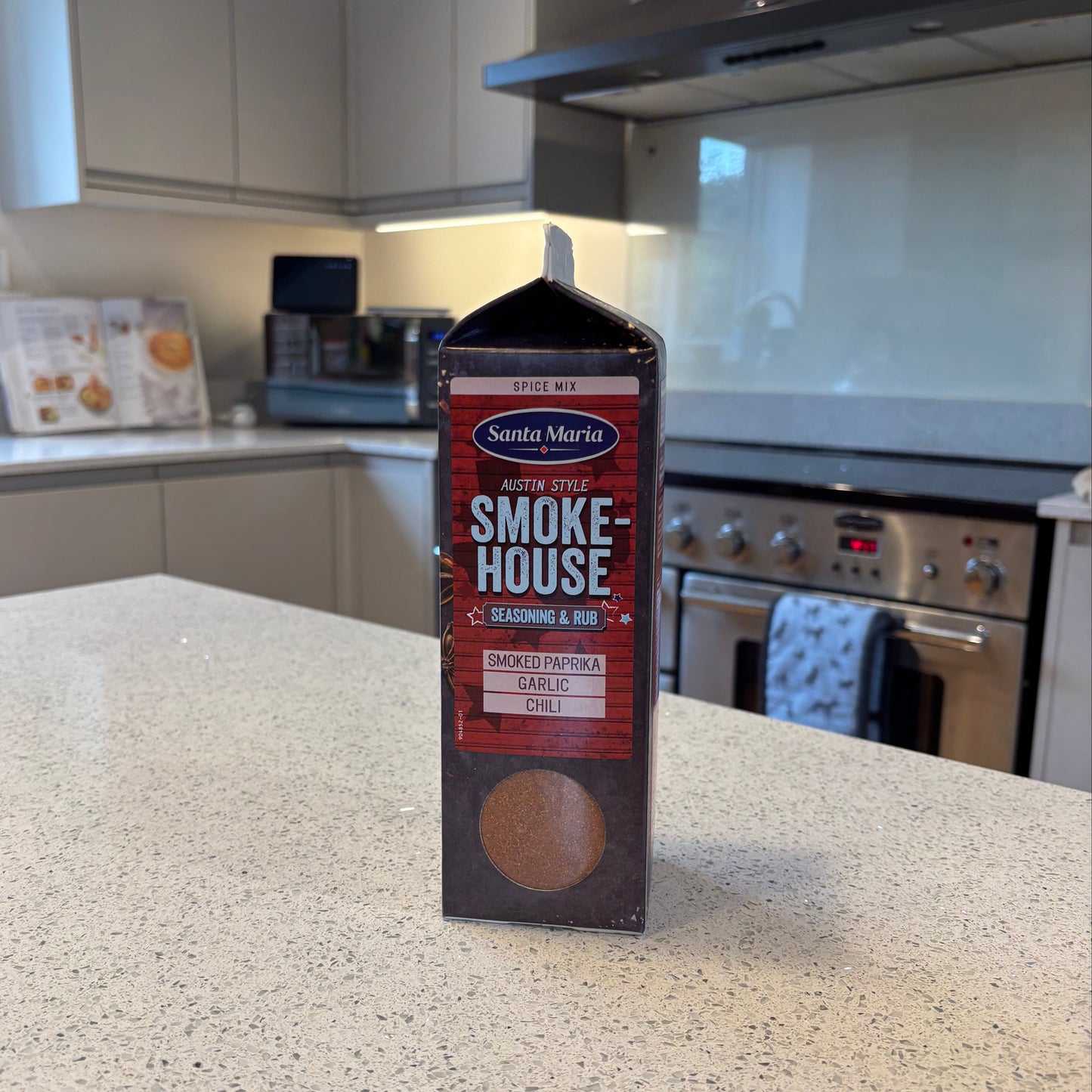 Box of Smokehouse seasoning on a kitchen counter with appliances in the background