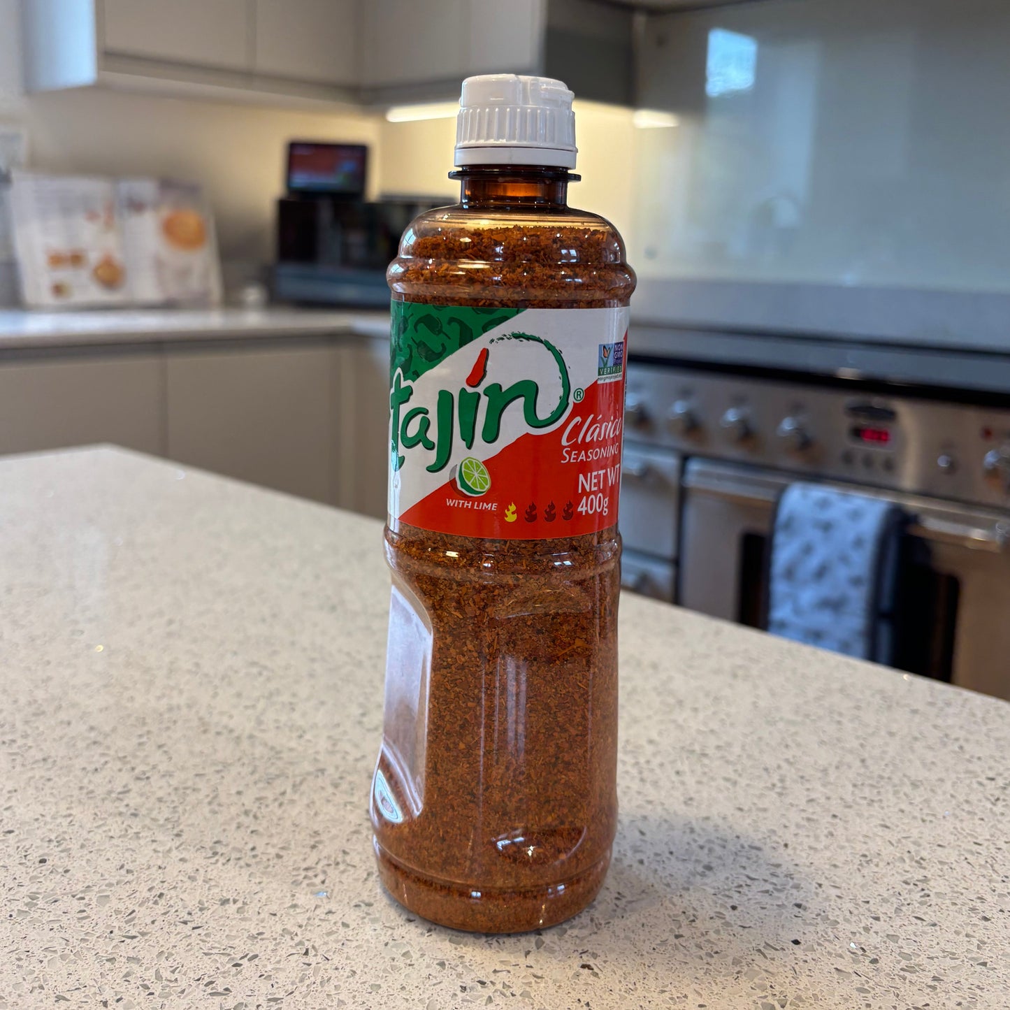 Bottle of tajin clasico chilli and lime seasoning on a kitchen counter